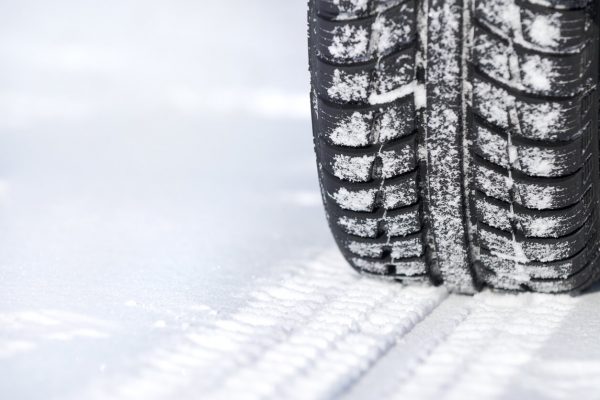 Tire in snow showing when to replace winter tires