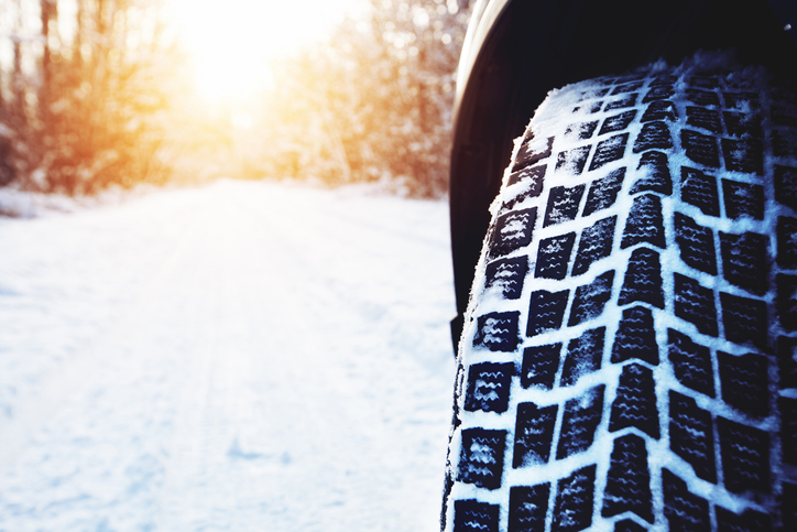 Car tires on winter road