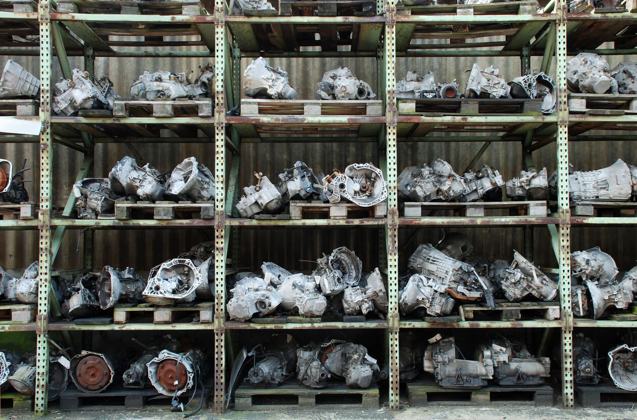 A variety of used parts sitting on a shelf