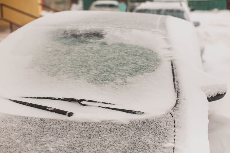 A photo of a car covered in ice.