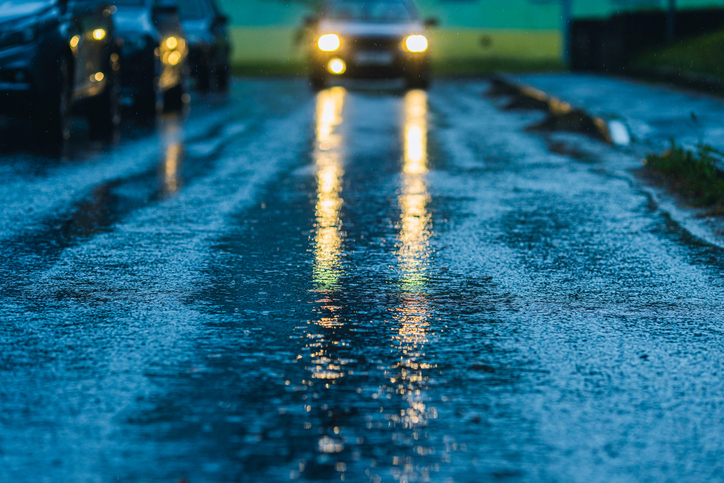 Car headlights on a wet road.